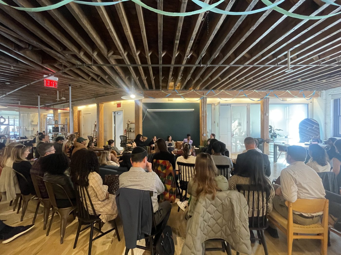 F3 community event panel discussion in a loft space